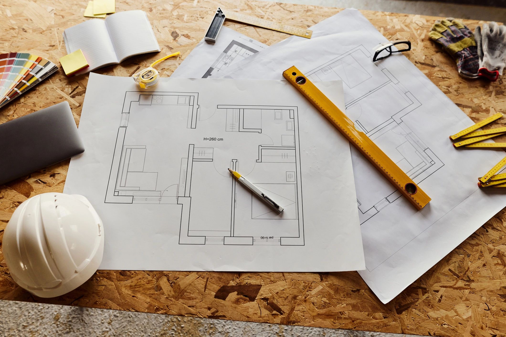 Architectural tools and blueprints on a planning desk