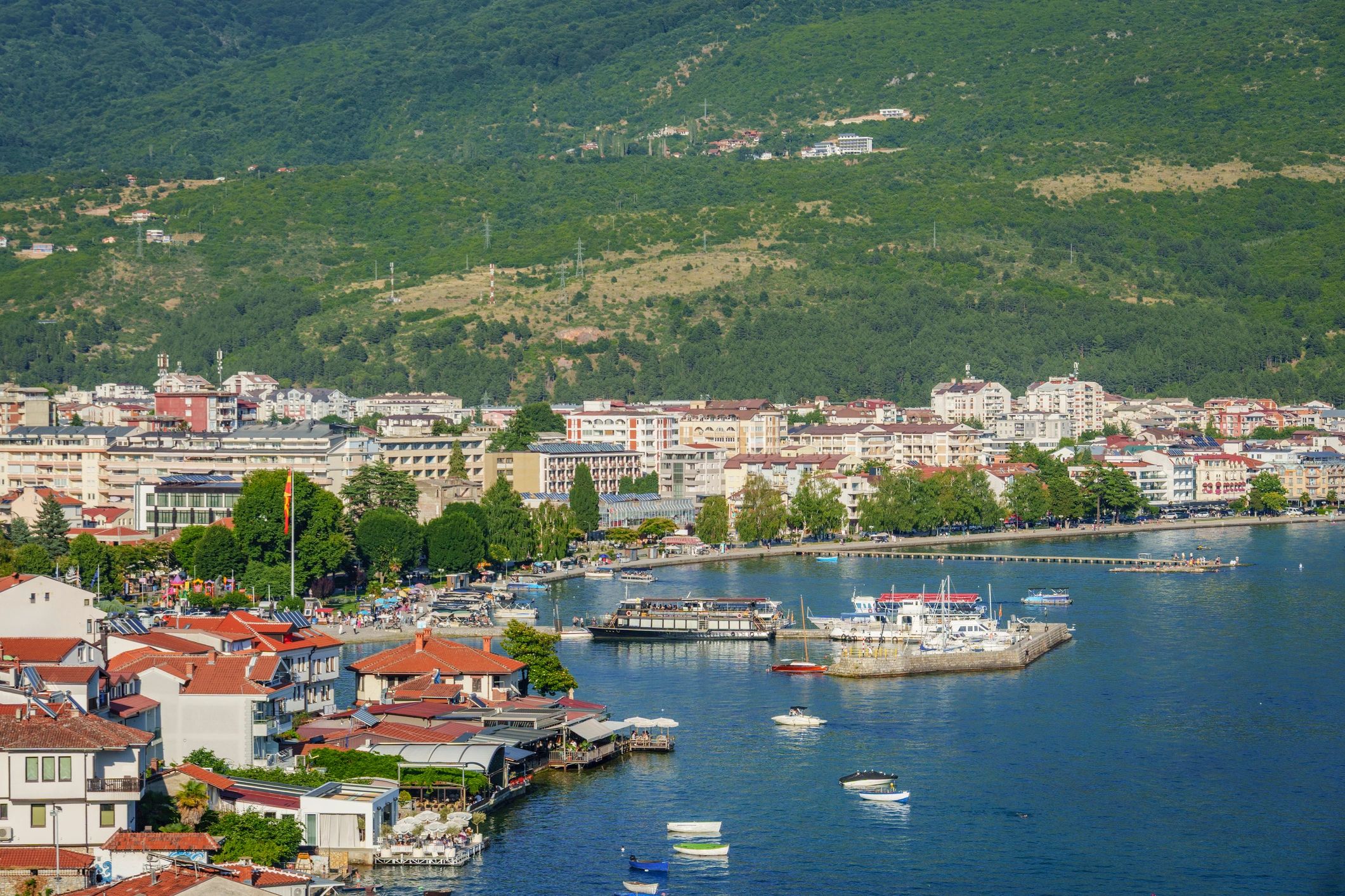 Mountain landscape and waterfront town representing terrain-aware project context